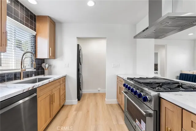a kitchen with a stove and a sink
