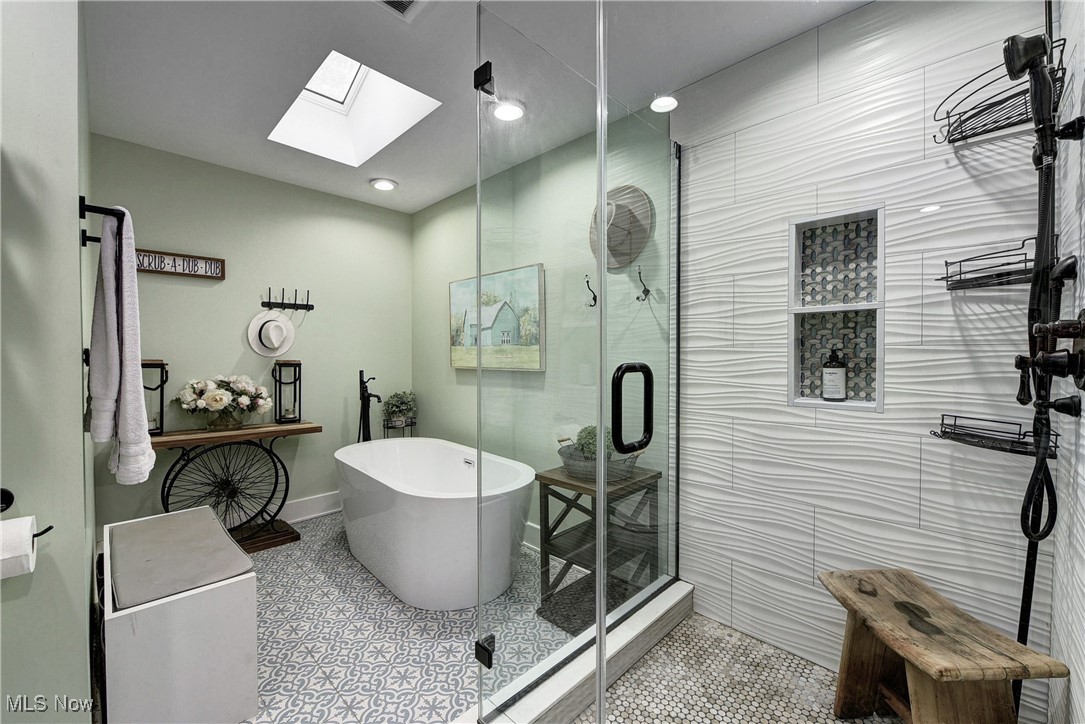5927 Highland Road Highland Heights, OH 44143 - Photo 18 of 22 Bathroom with shower with separate bathtub, a skylight, and tile patterned floors