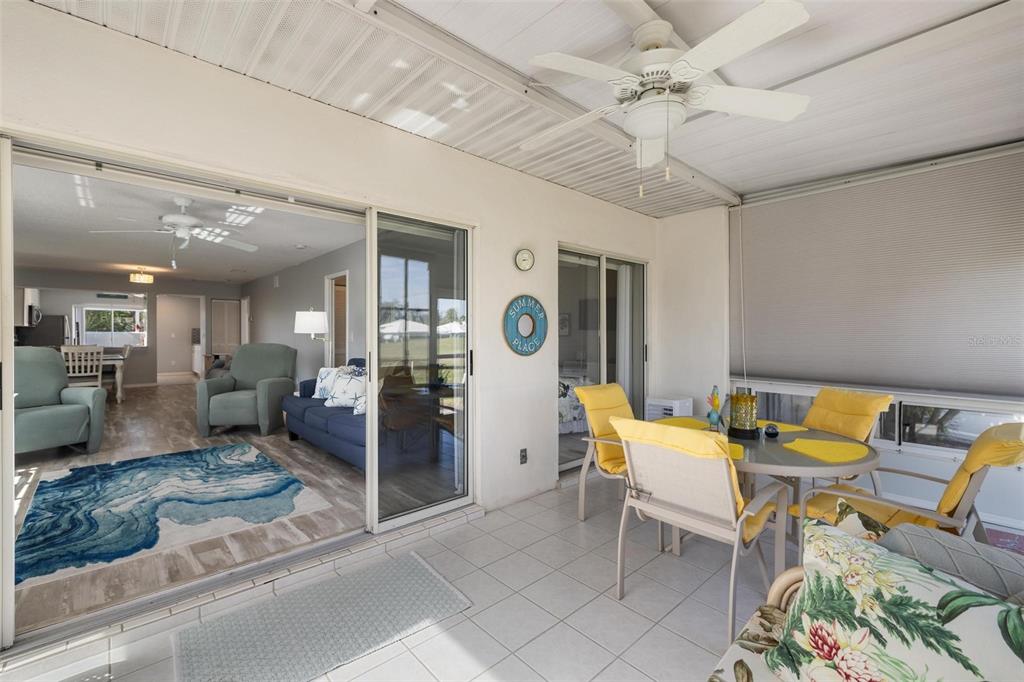 276 Cerromar Way South, Unit 60 Venice, FL 34293 - Photo 15 of 31 a living room with furniture and a chandelier