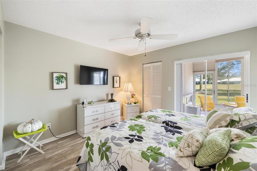 276 Cerromar Way South, Unit 60 Venice, FL 34293 - Photo 21 of 31 a bedroom with a bed and furniture