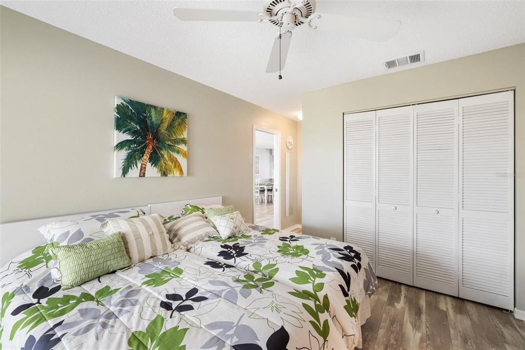 276 Cerromar Way South, Unit 60 Venice, FL 34293 - Photo 22 of 31 a bedroom with bed and a chandelier