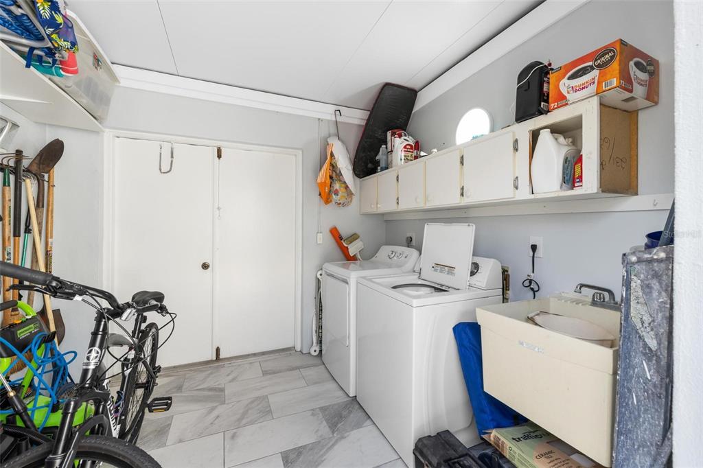 276 Cerromar Way South, Unit 60 Venice, FL 34293 - Photo 24 of 31 a utility room with dryer and washer