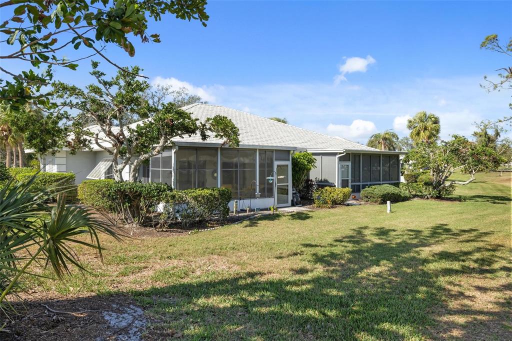 276 Cerromar Way South, Unit 60 Venice, FL 34293 - Photo 26 of 31 a view of a house with backyard and sitting area