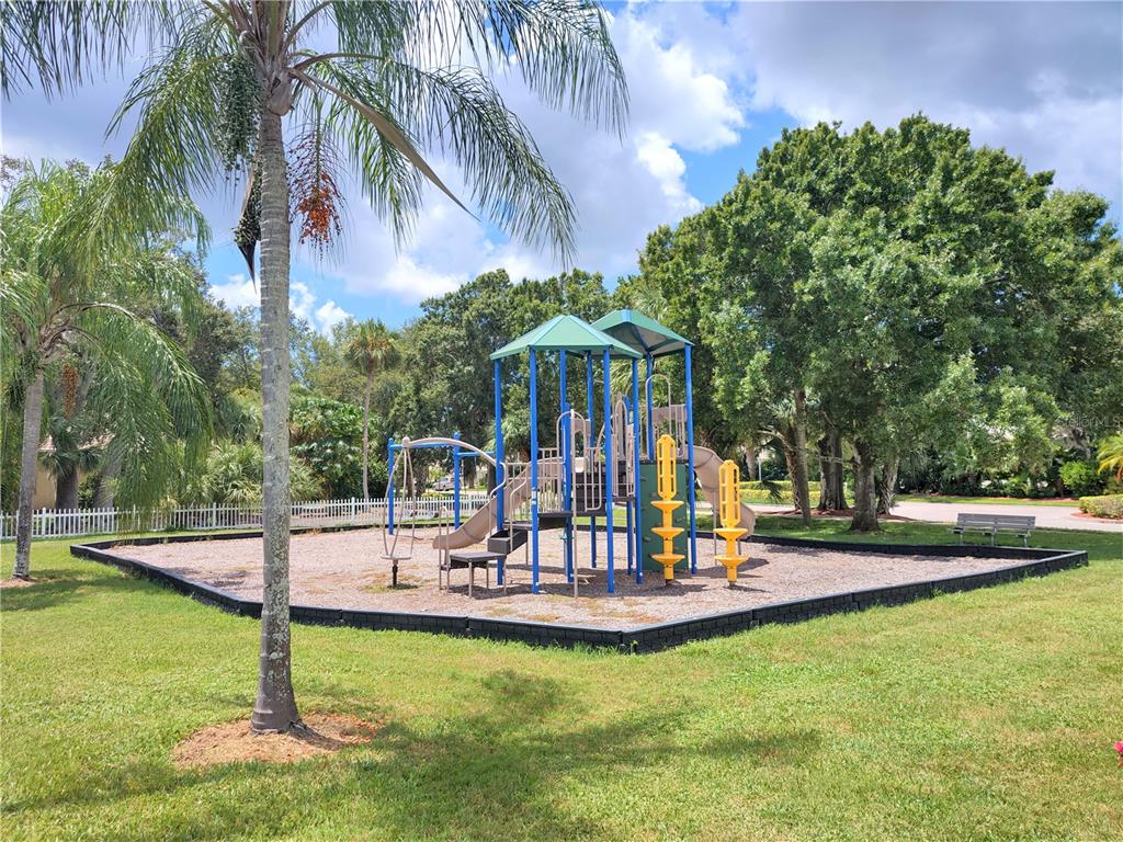 276 Cerromar Way South, Unit 60 Venice, FL 34293 - Photo 30 of 31 a view of a swimming pool with a table and chairs