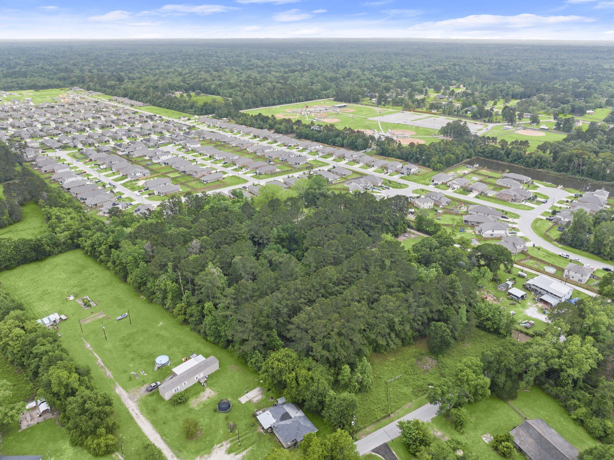 15399 Memorial Drive Splendora, TX 77372 - Photo 14 of 15 a view of an outdoor space and lakeside