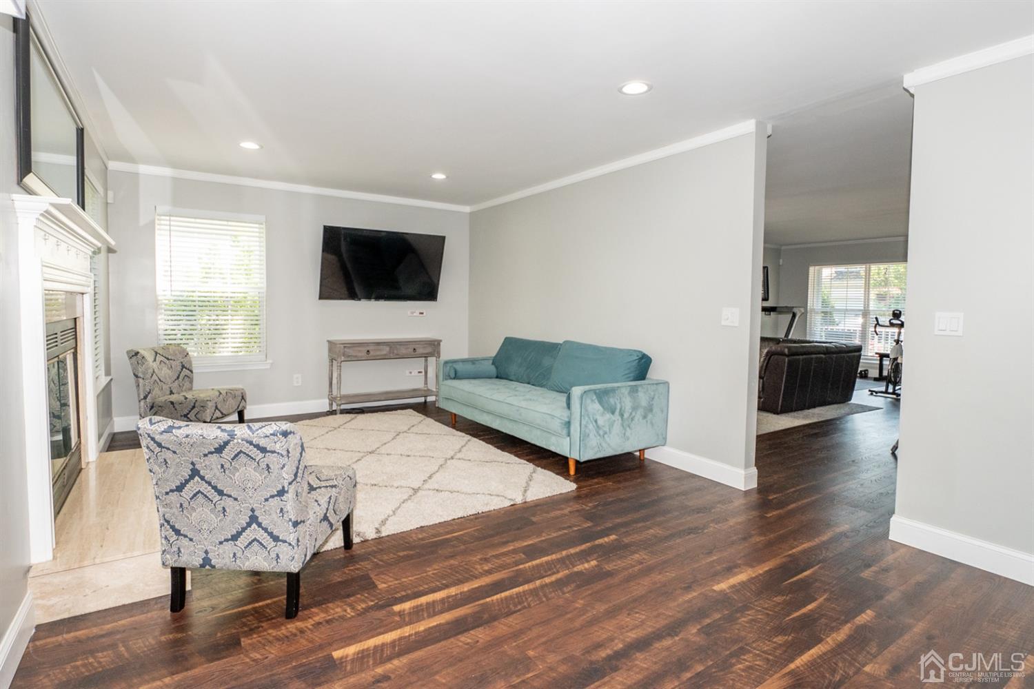 42 Springfield Road North Brunswick, NJ 08902 - Photo 12 of 37 a living room with furniture and a flat screen tv