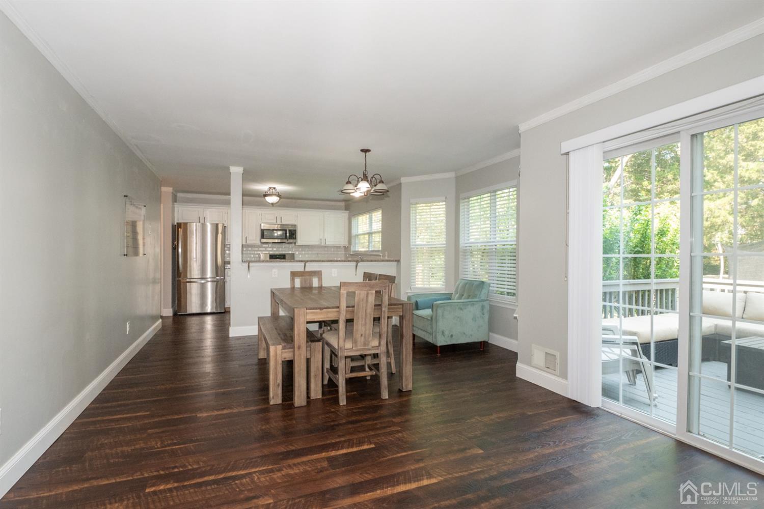 42 Springfield Road North Brunswick, NJ 08902 - Photo 14 of 37 a view of a dining room with furniture and wooden floor