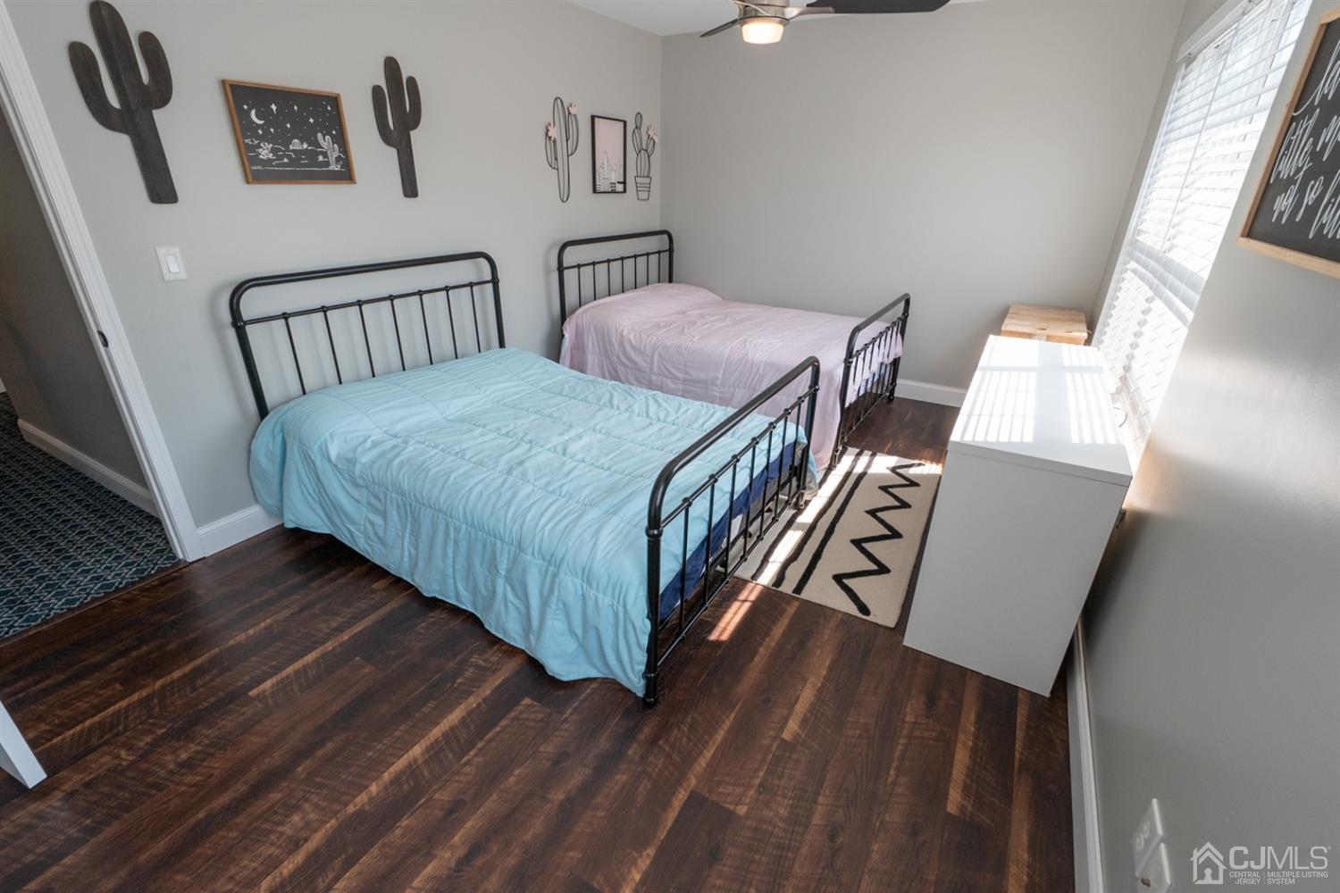 42 Springfield Road North Brunswick, NJ 08902 - Photo 21 of 37 a bedroom with a bed and wooden floor