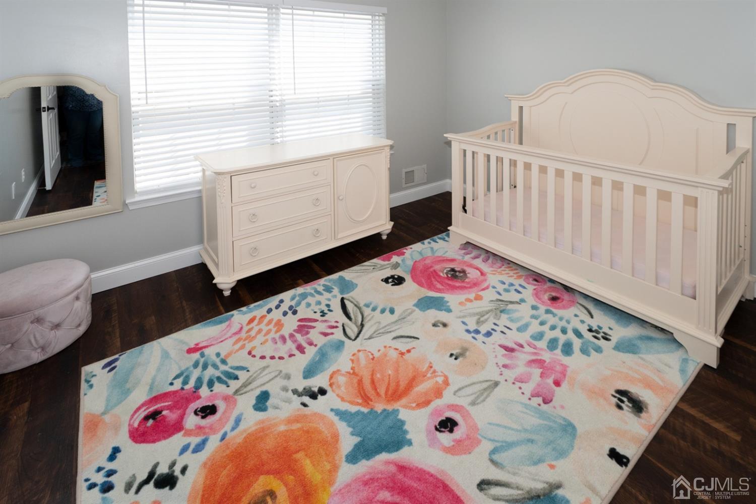 42 Springfield Road North Brunswick, NJ 08902 - Photo 22 of 37 a bedroom with a bed and a dresser in it