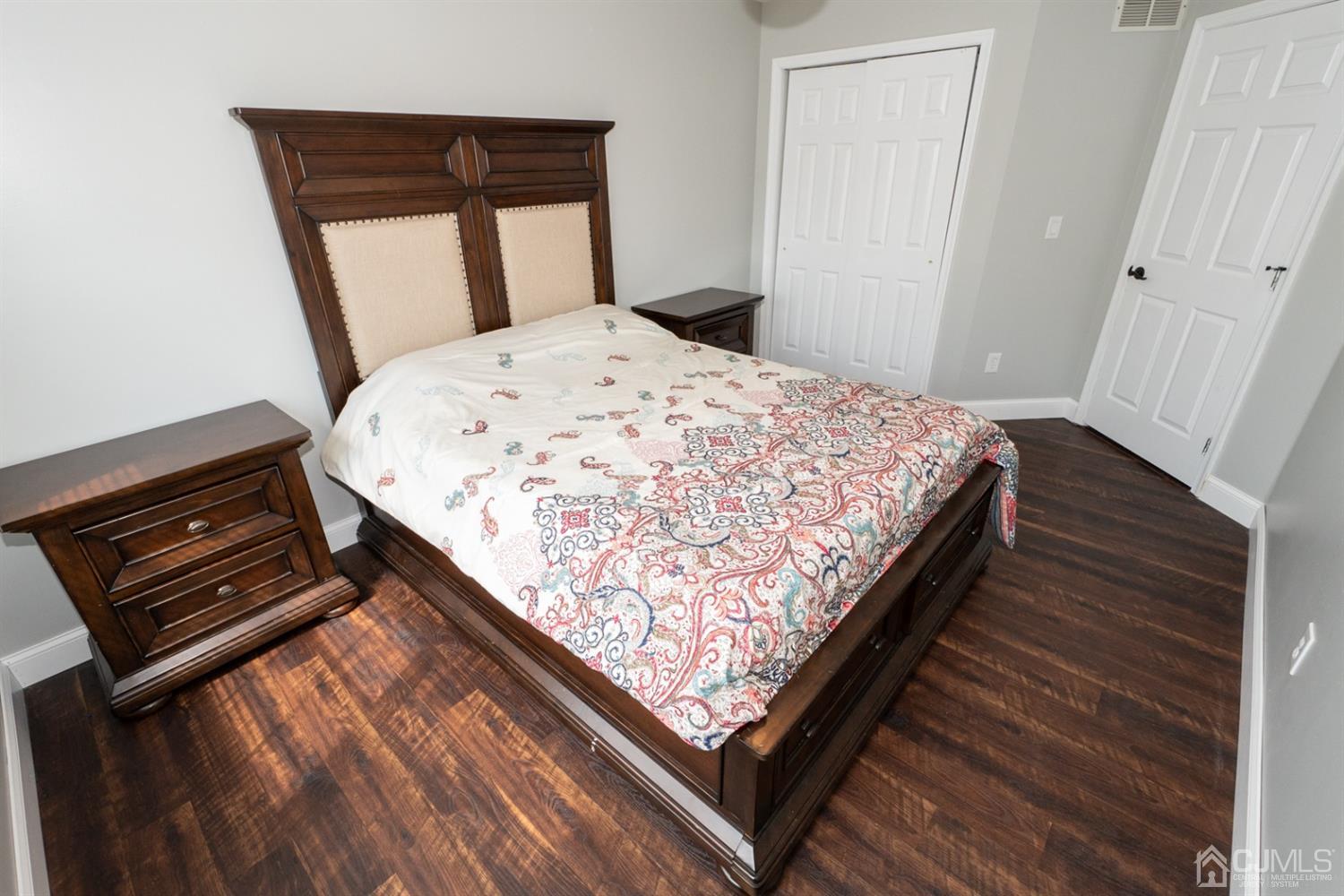 42 Springfield Road North Brunswick, NJ 08902 - Photo 23 of 37 a bedroom with wooden bed and window