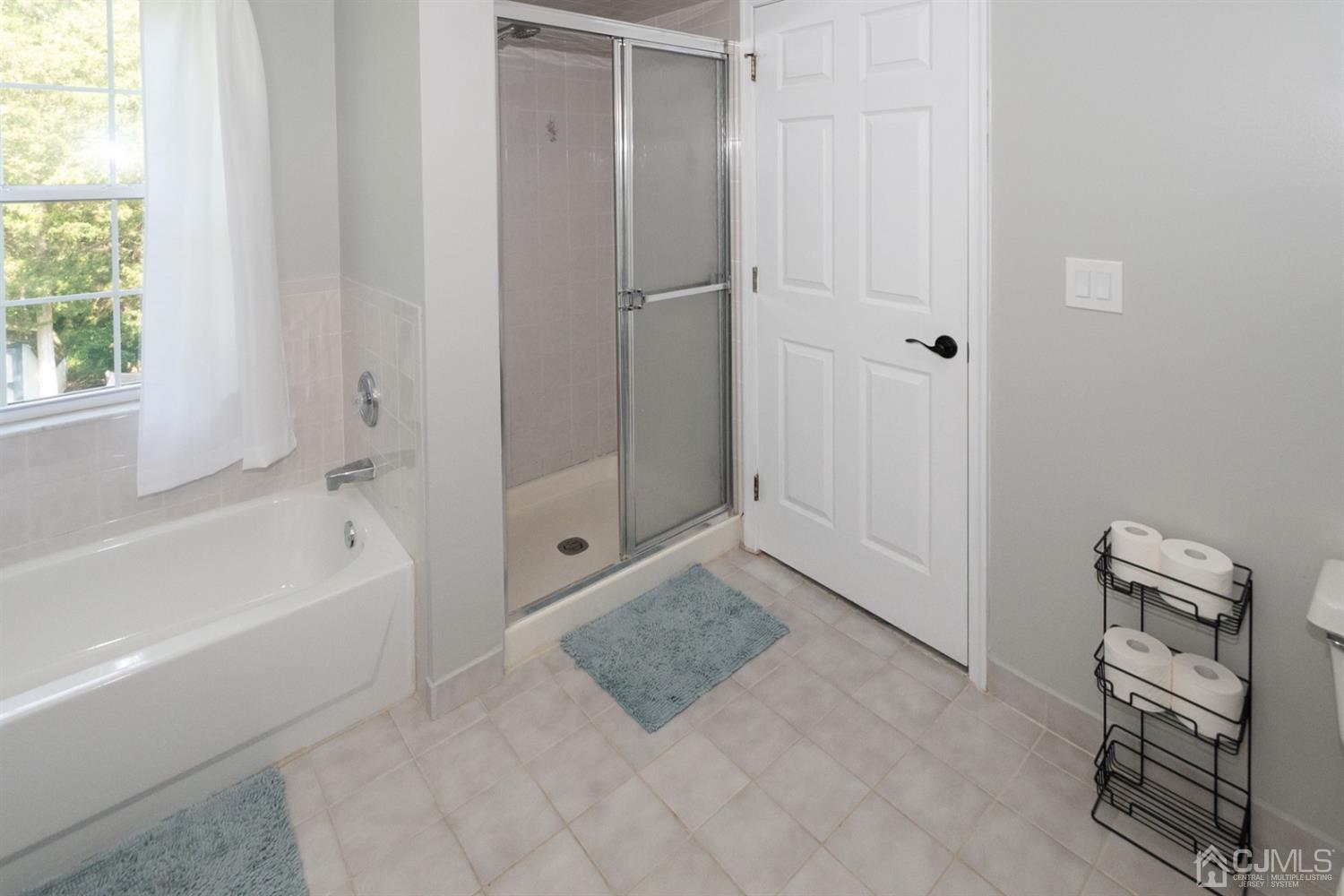 42 Springfield Road North Brunswick, NJ 08902 - Photo 27 of 37 a bathroom with a bathtub and a shower