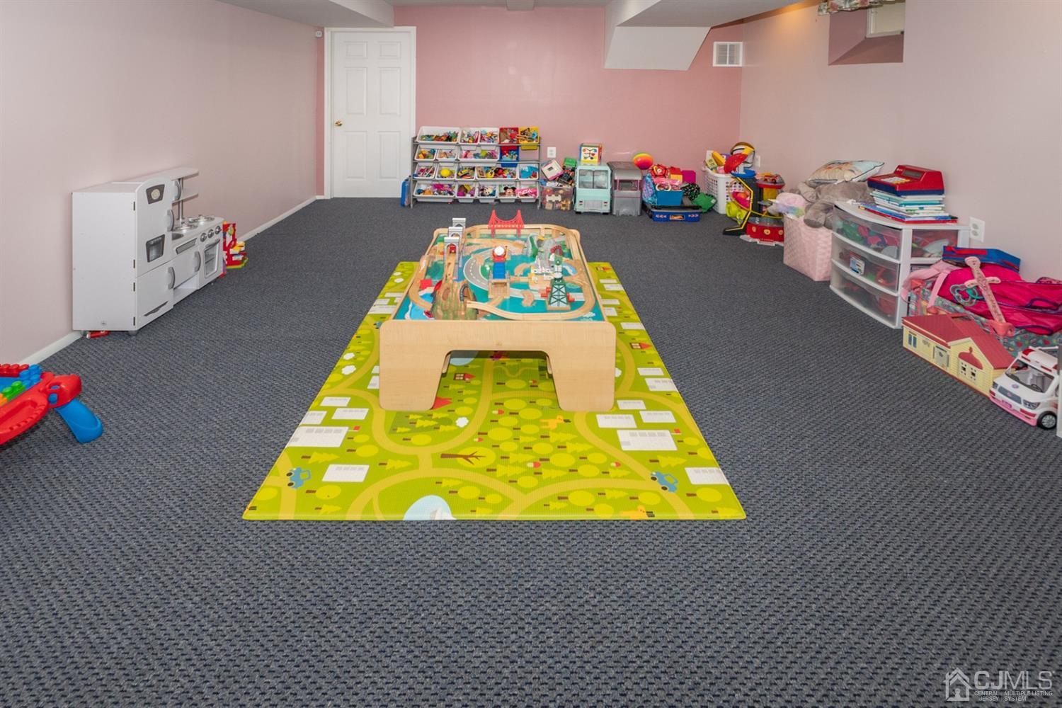 42 Springfield Road North Brunswick, NJ 08902 - Photo 29 of 37 a bed room with a bed and toys