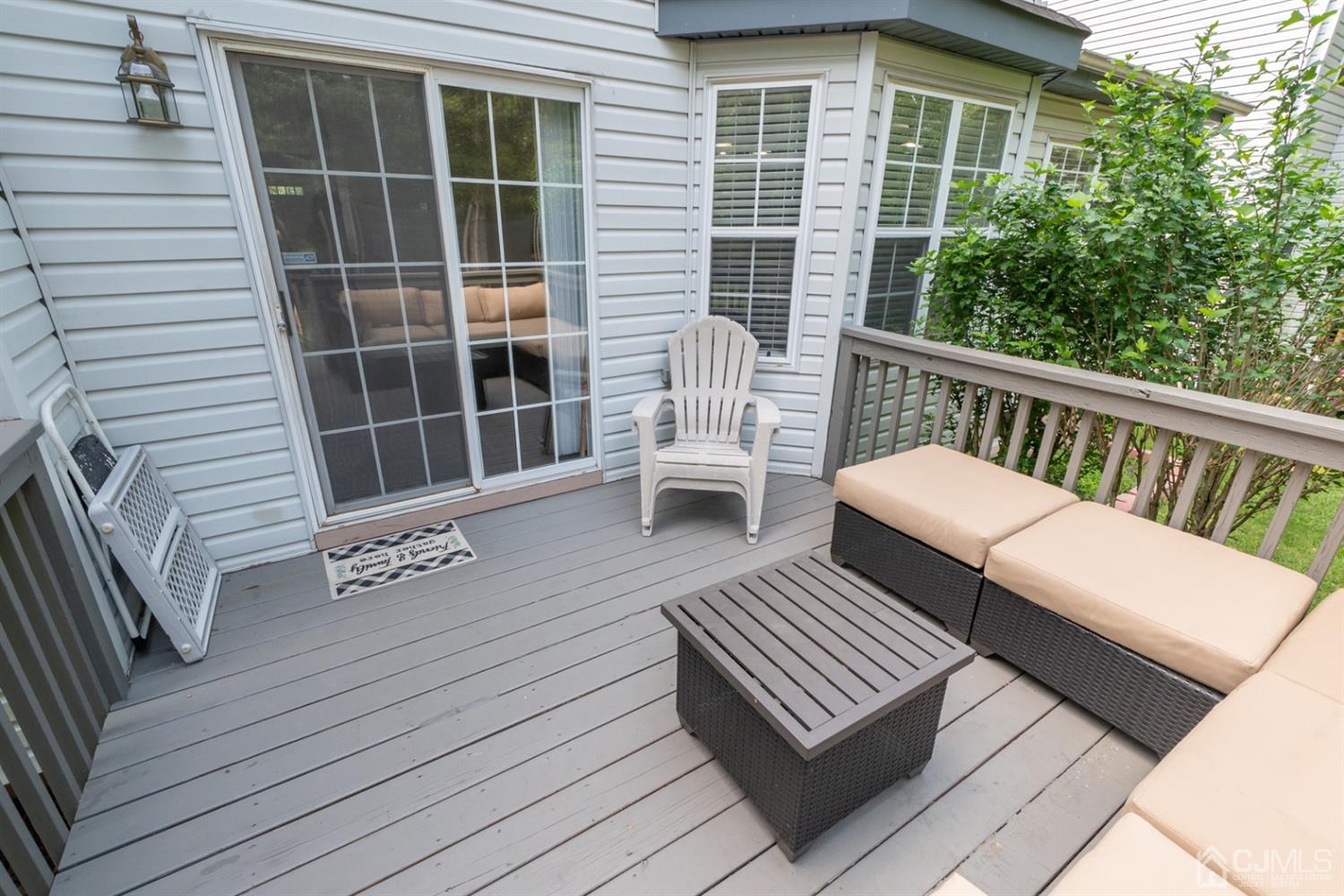 42 Springfield Road North Brunswick, NJ 08902 - Photo 34 of 37 a view of a wooden chairs on the deck