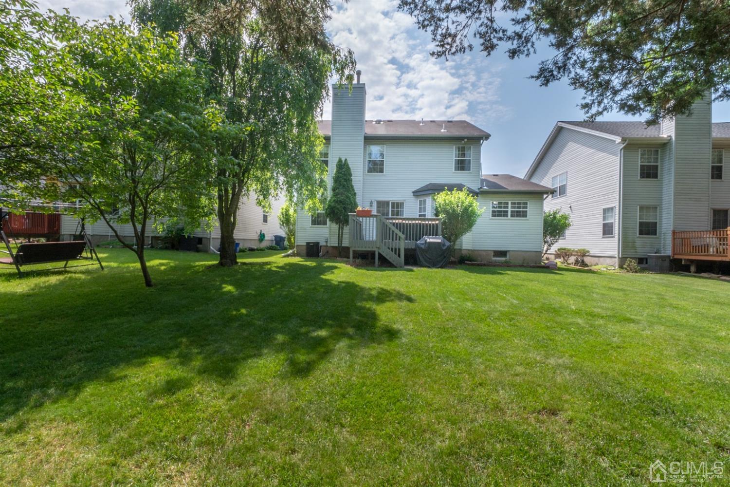 42 Springfield Road North Brunswick, NJ 08902 - Photo 37 of 37 a front view of a house with garden and trees