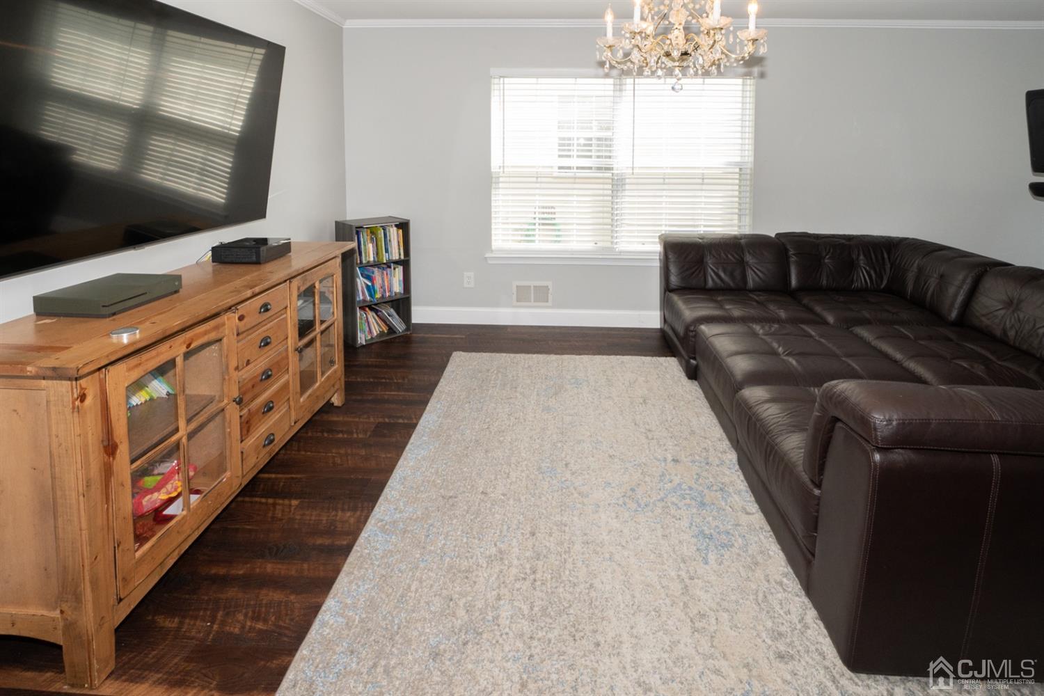 42 Springfield Road North Brunswick, NJ 08902 - Photo 7 of 37 a living room with furniture flat screen tv and a window