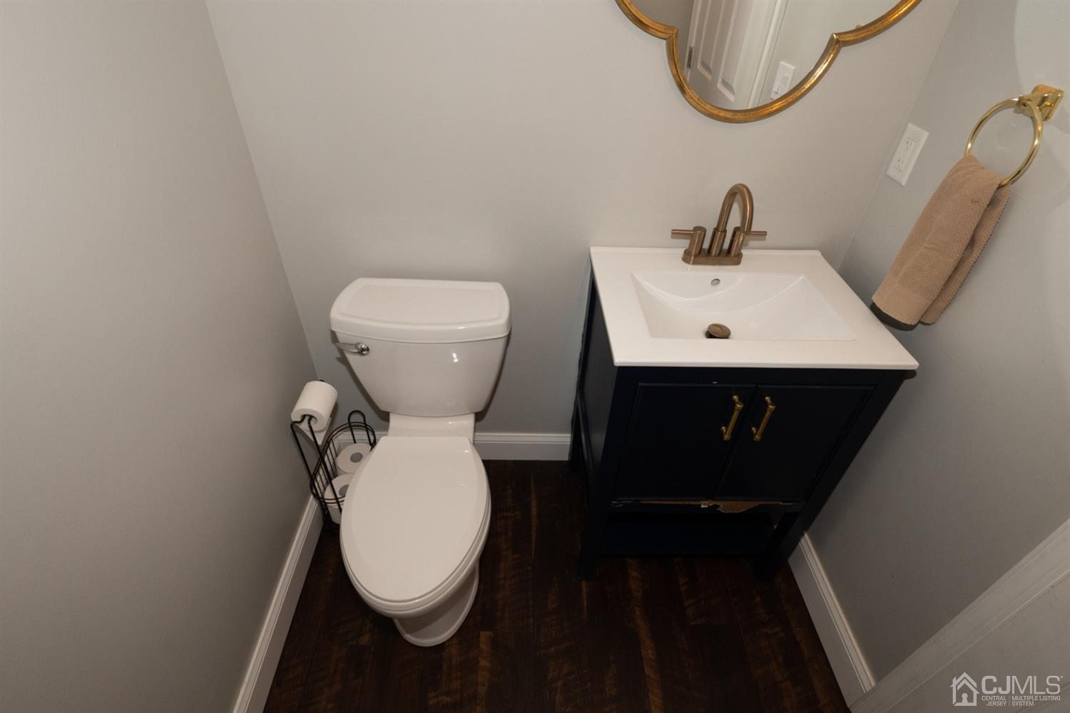 42 Springfield Road North Brunswick, NJ 08902 - Photo 9 of 37 a bathroom with a toilet sink and a mirror