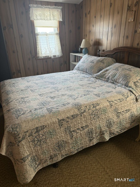 105 Shore Road Clinton, CT 06413 - Photo 14 of 19 The largest bedroom on the second floor has a peek of the water through the window.