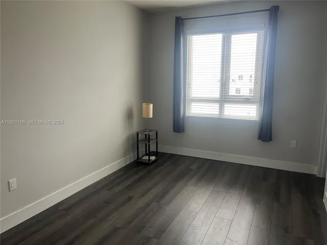 a bathroom with a sink toilet vanity and shower
