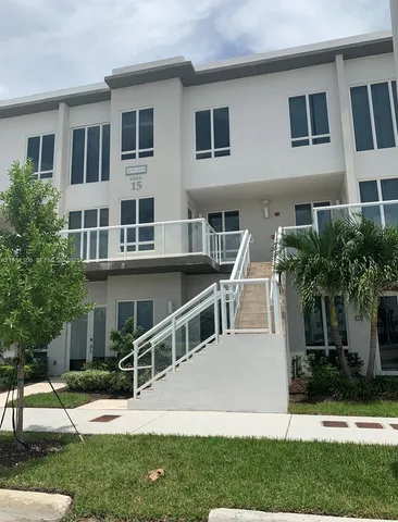 a house that has a big yard and large trees