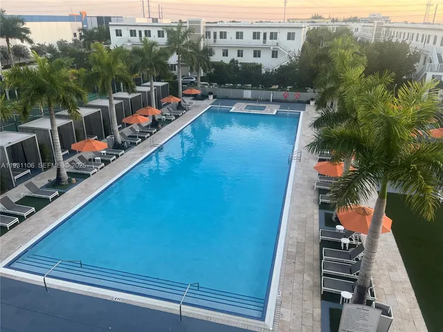 a view of a swimming pool with a patio