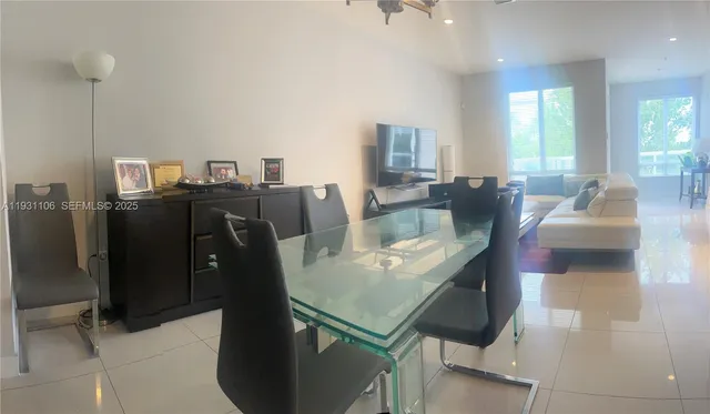 a kitchen with stainless steel appliances a sink stove and refrigerator