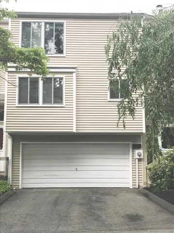 a front view of a house with a garage