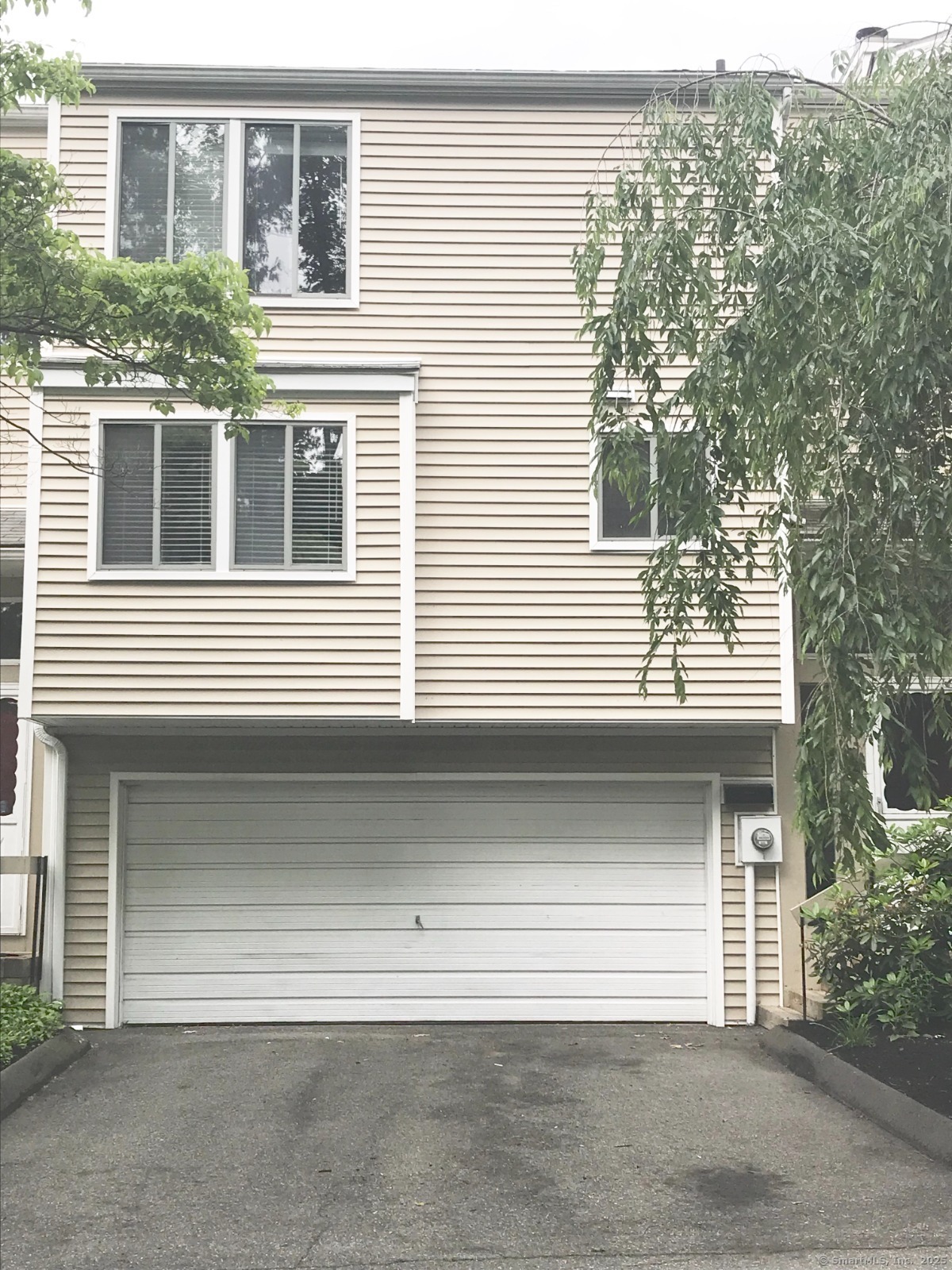a front view of a house with a garage