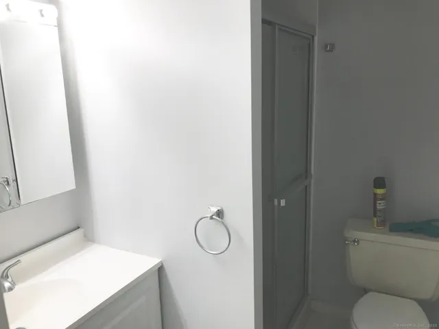a bathroom with a toilet and a sink