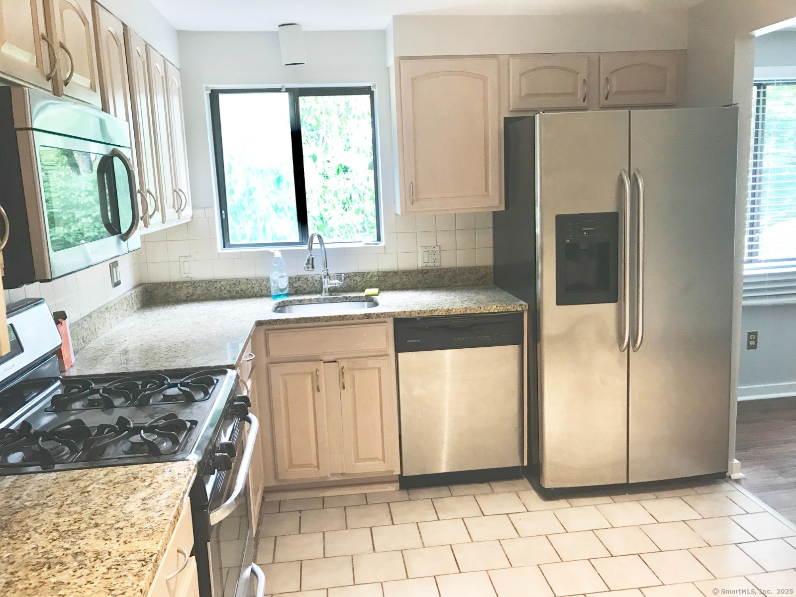 140 Shepard Avenue, Unit 140 Hamden, CT 06514 - Photo 4 of 29 a kitchen with a sink stove and refrigerator