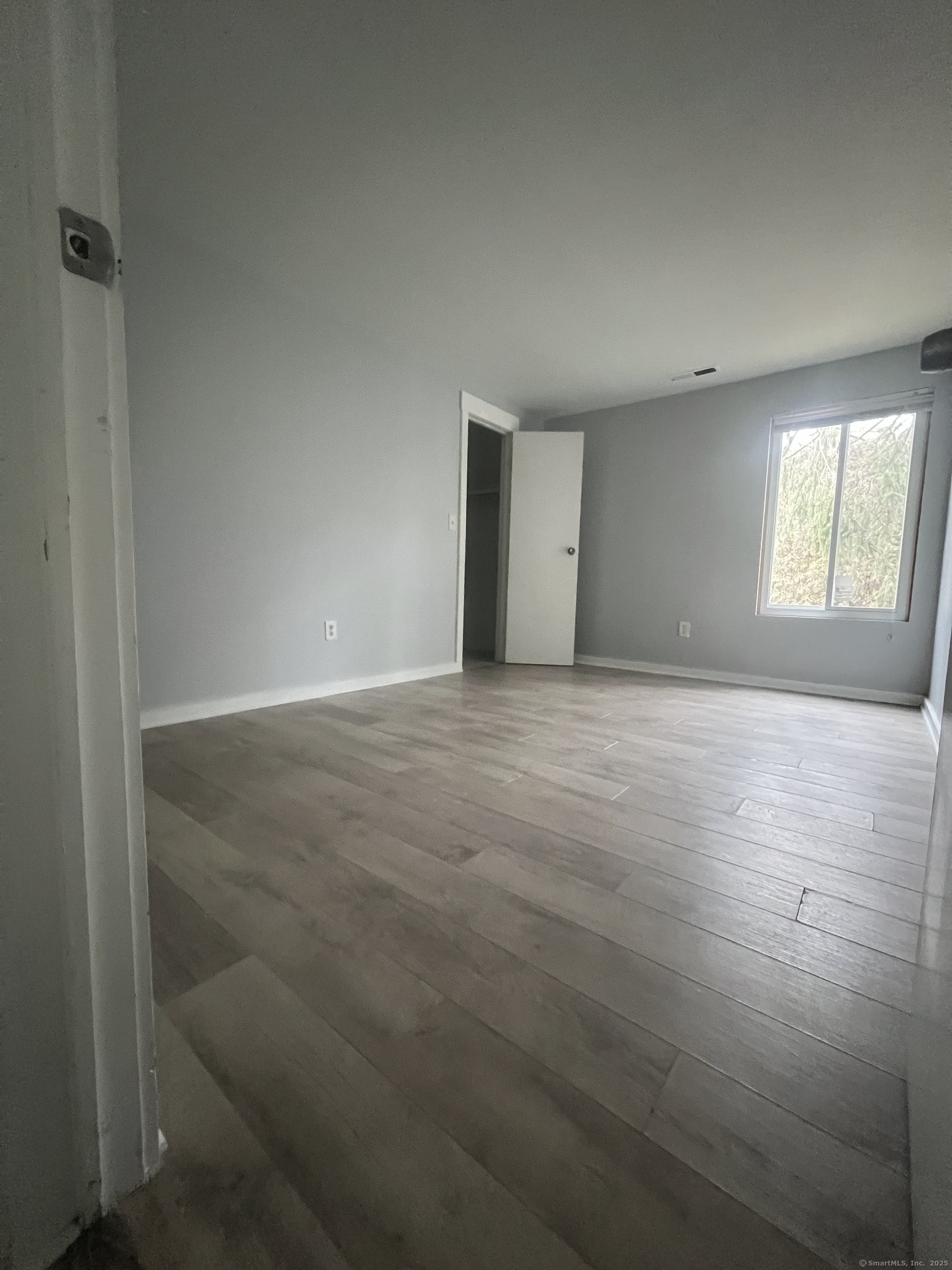 140 Shepard Avenue, Unit 140 Hamden, CT 06514 - Photo 8 of 29 a view of empty room with window