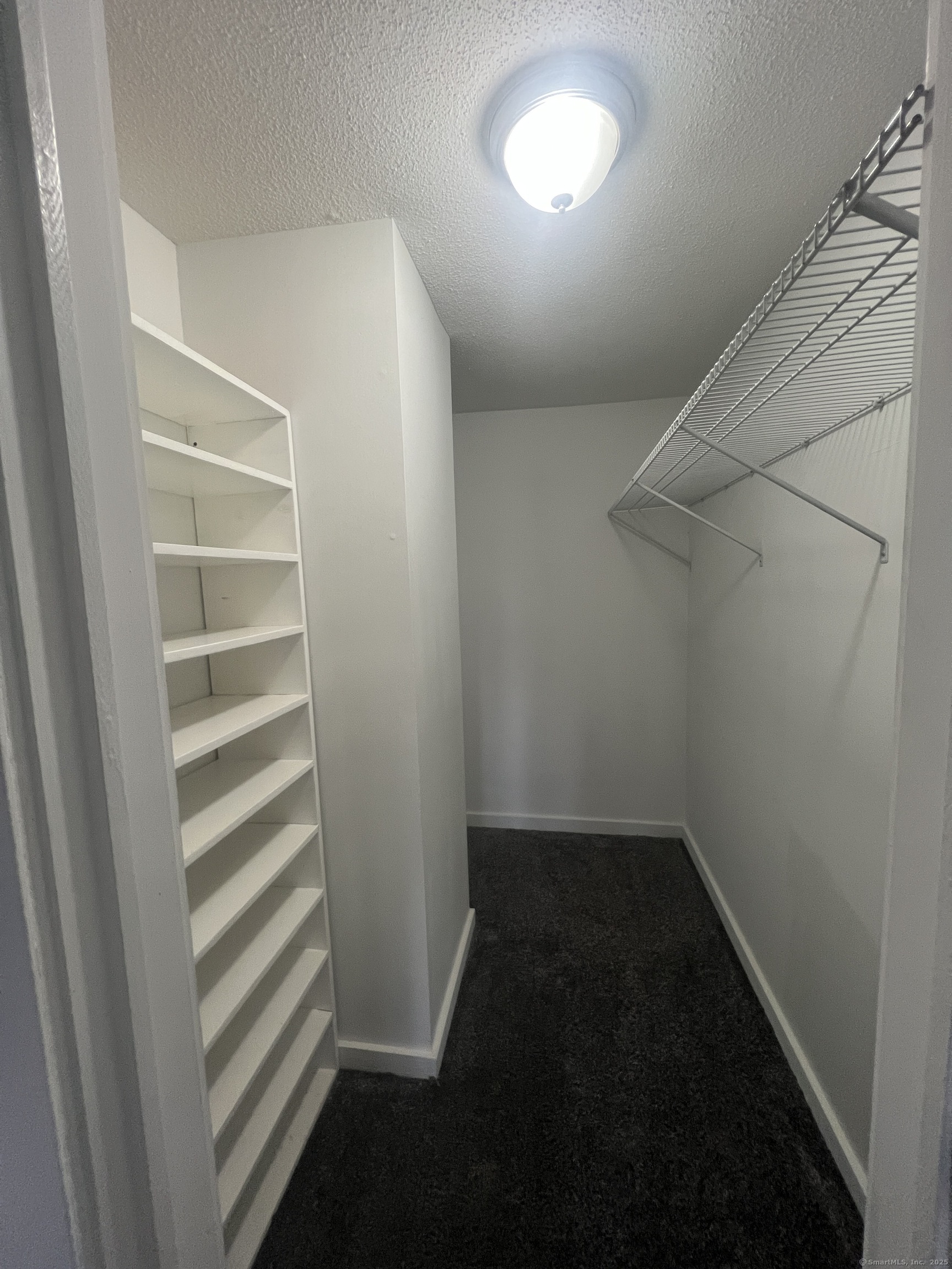 140 Shepard Avenue, Unit 140 Hamden, CT 06514 - Photo 10 of 29 wooden floor in an empty room