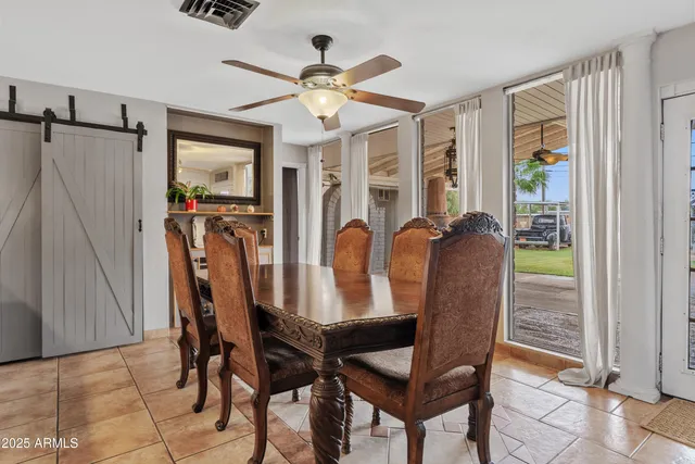 a dining room with furniture and window