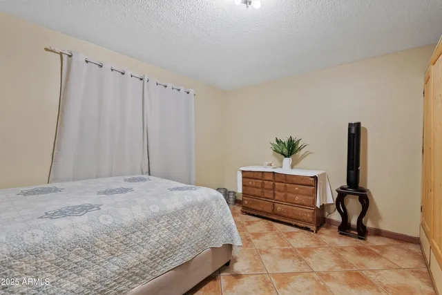 a bedroom with a bed and furniture