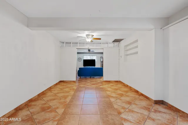 a view of an empty room with a fireplace