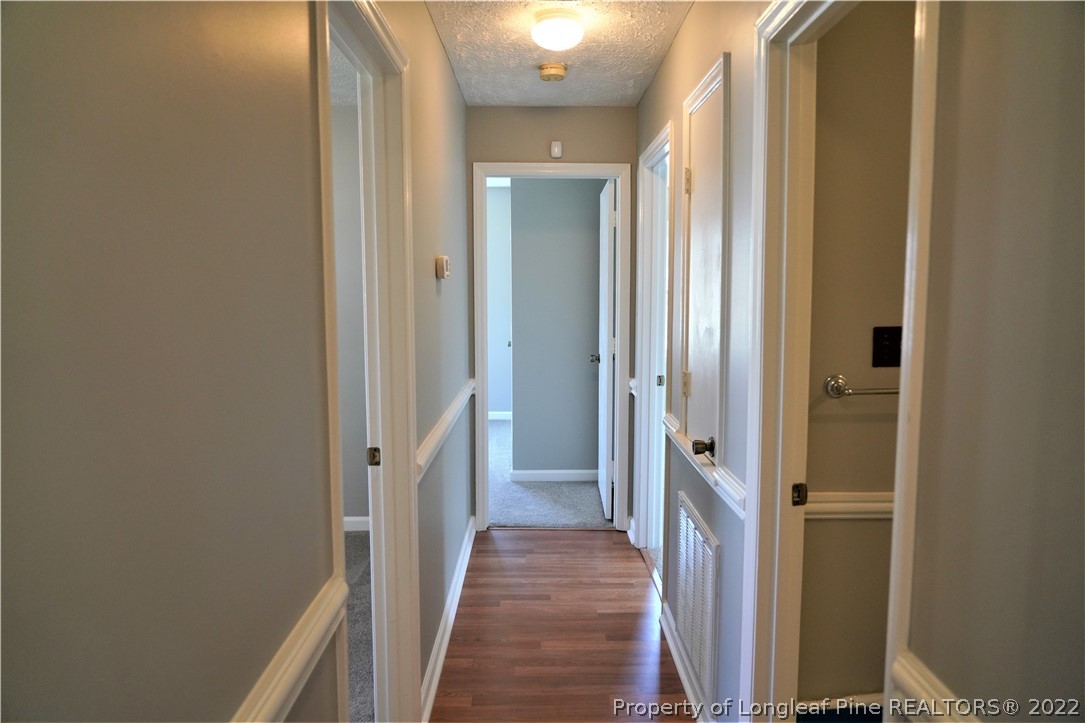 2247 Wade-Stedman Road Stedman, NC 28391 - Photo 9 of 14 a view of a hallway with a wooden door