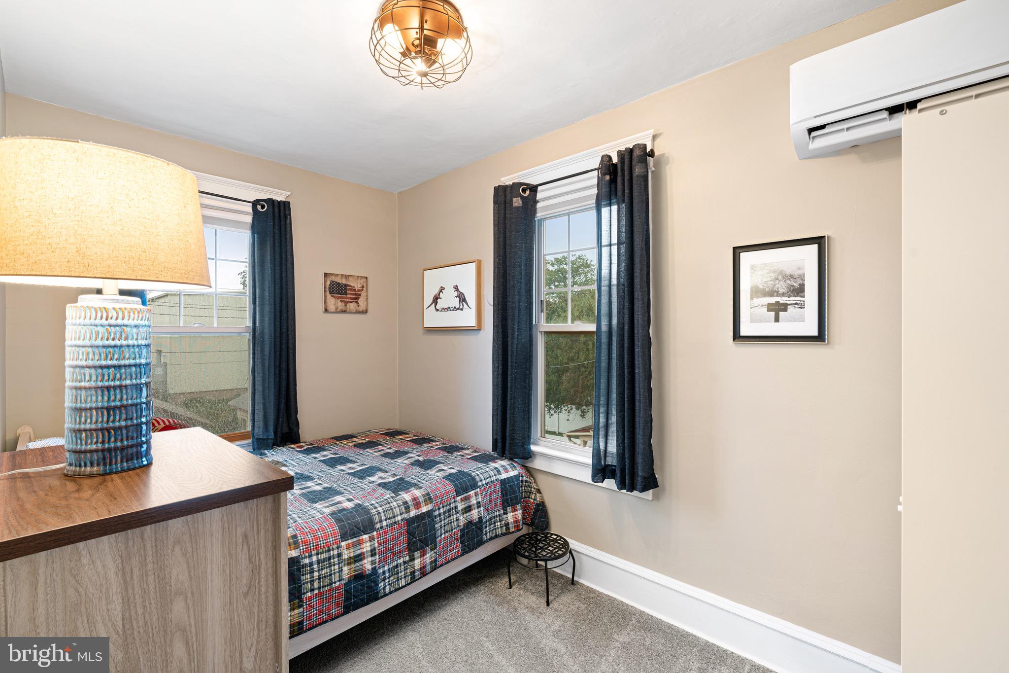 227 7th Avenue Haddon Heights, NJ 08035 - Photo 15 of 26 a bedroom with a bed lamp and a window