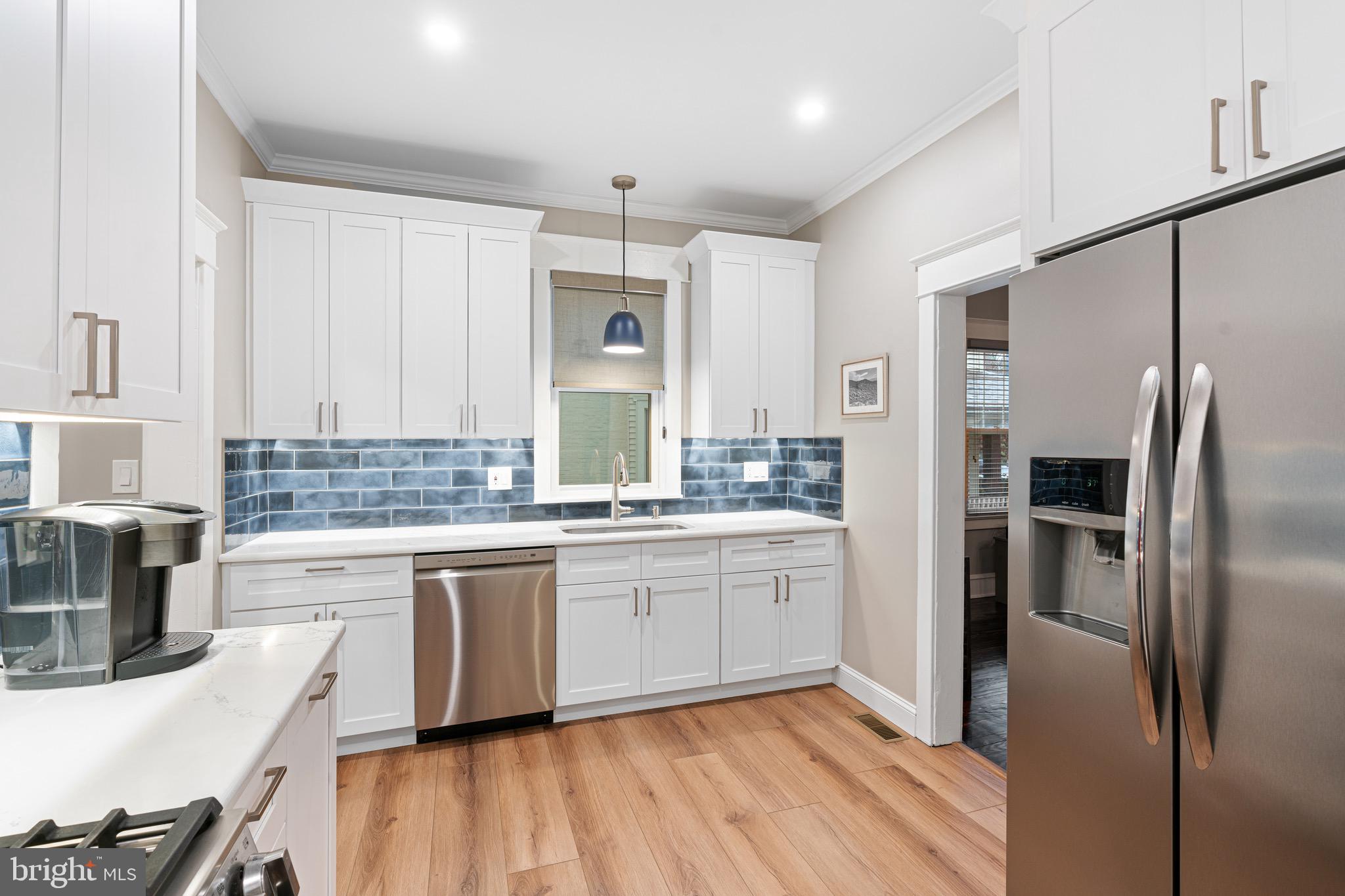 227 7th Avenue Haddon Heights, NJ 08035 - Photo 9 of 26 a kitchen with stainless steel appliances granite countertop a refrigerator and a stove top oven