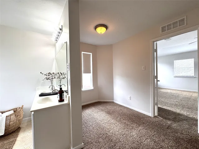 a view of an empty room and window