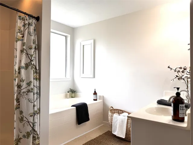 a bathroom with a sink and a bathtub