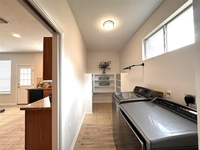 a kitchen view with a stove and a refrigerator