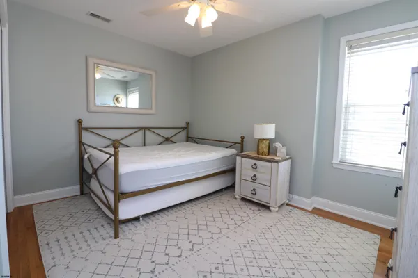 a bed room with a bed and a window