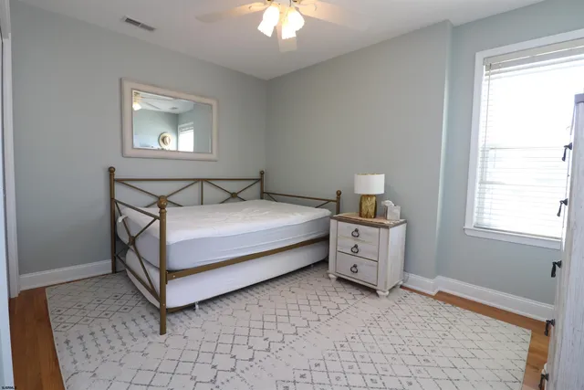 a bed room with a bed and a window