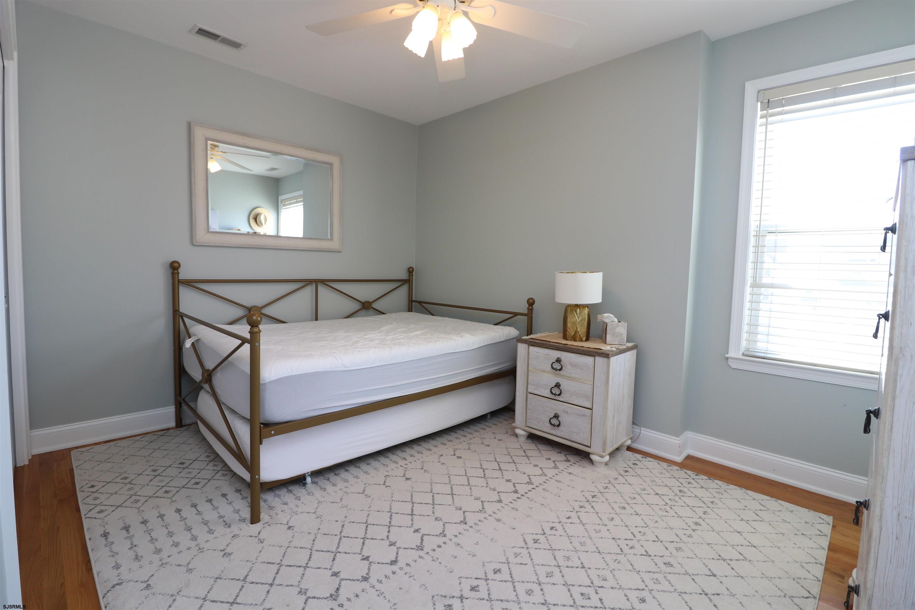 200 North Decatur Avenue, Unit 5 Margate City, NJ 08402 - Photo 12 of 16 a bed room with a bed and a window