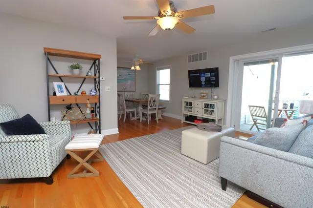 a living room with furniture fireplace and a flat screen tv