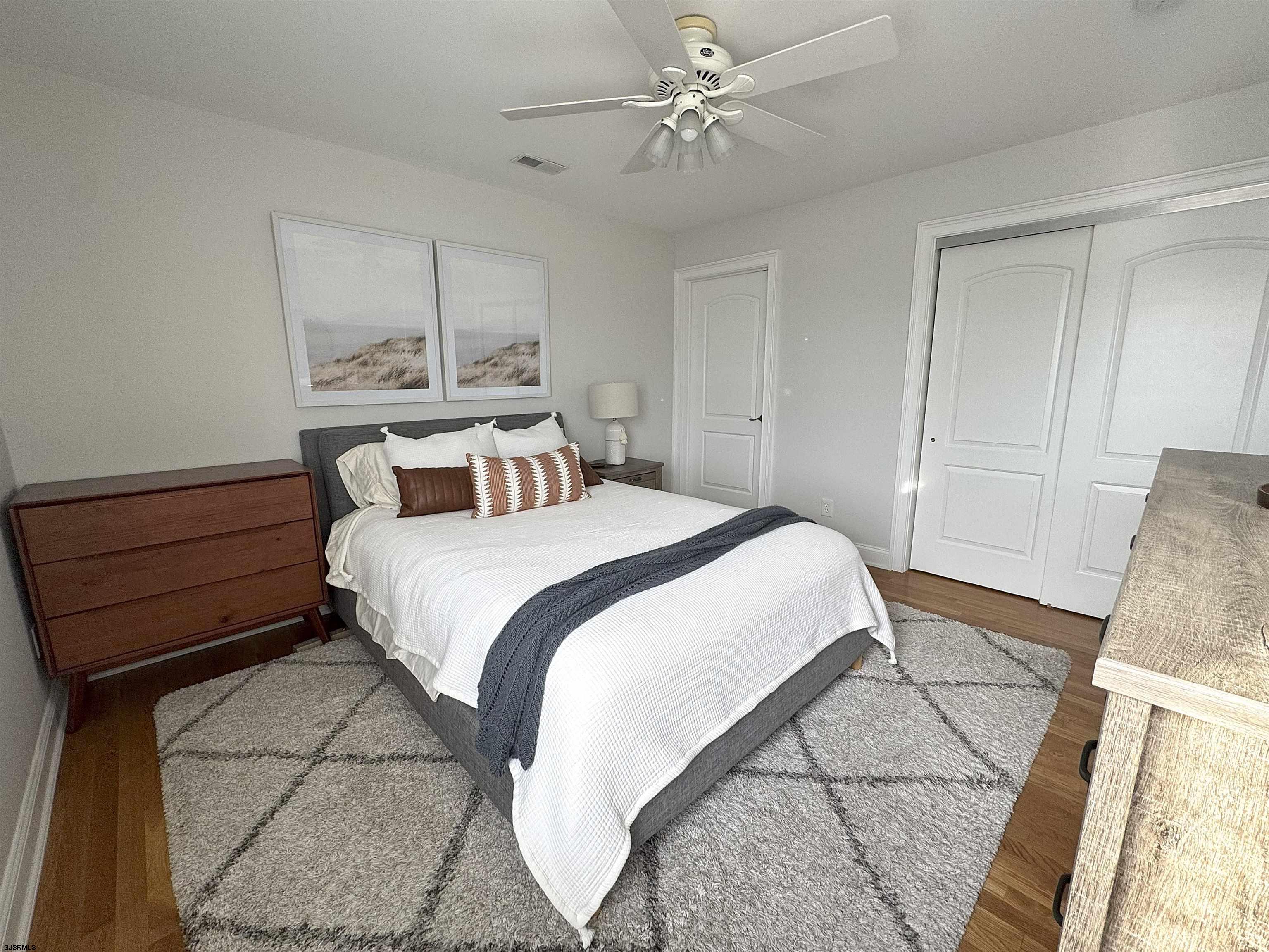 200 North Decatur Avenue, Unit 5 Margate City, NJ 08402 - Photo 10 of 16 a bedroom with a bed and a window