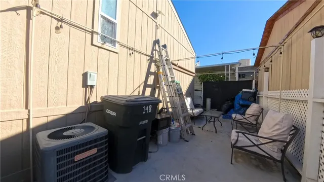 a view of living room with furniture and a window