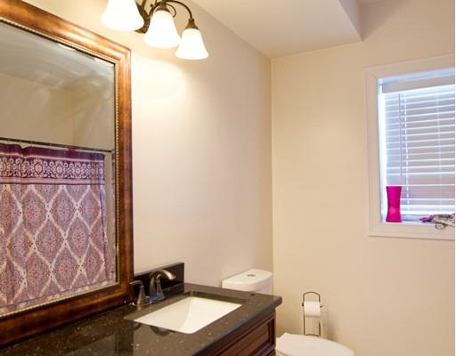 68 Alwin Place Springfield, MA 01128 - Photo 29 of 30 a bathroom with a sink and a mirror