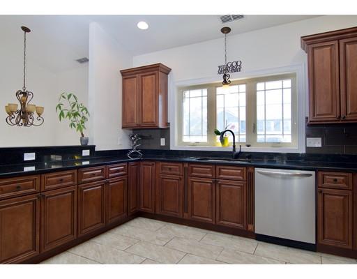 68 Alwin Place Springfield, MA 01128 - Photo 8 of 30 a kitchen with a sink window and cabinets