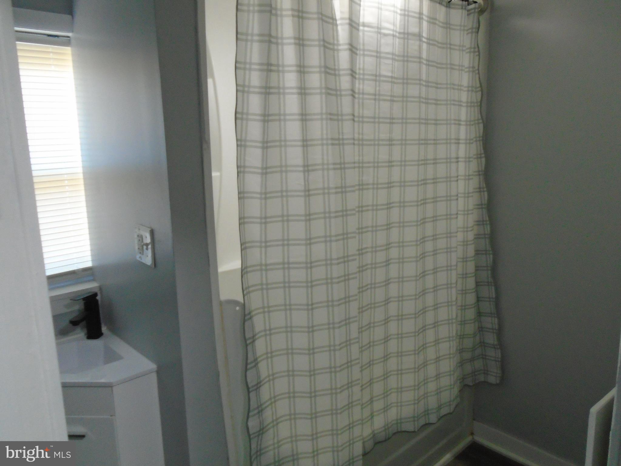 422 Wampler Road Baltimore, MD 21220 - Photo 5 of 10 a bathroom with a shower
