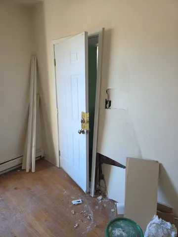 a view of livingroom with hardwood floor and a window